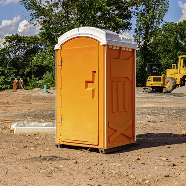 what is the cost difference between standard and deluxe portable restroom rentals in Dittmer